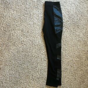 Bebe black leggings in small with vegan leather detail on the sides